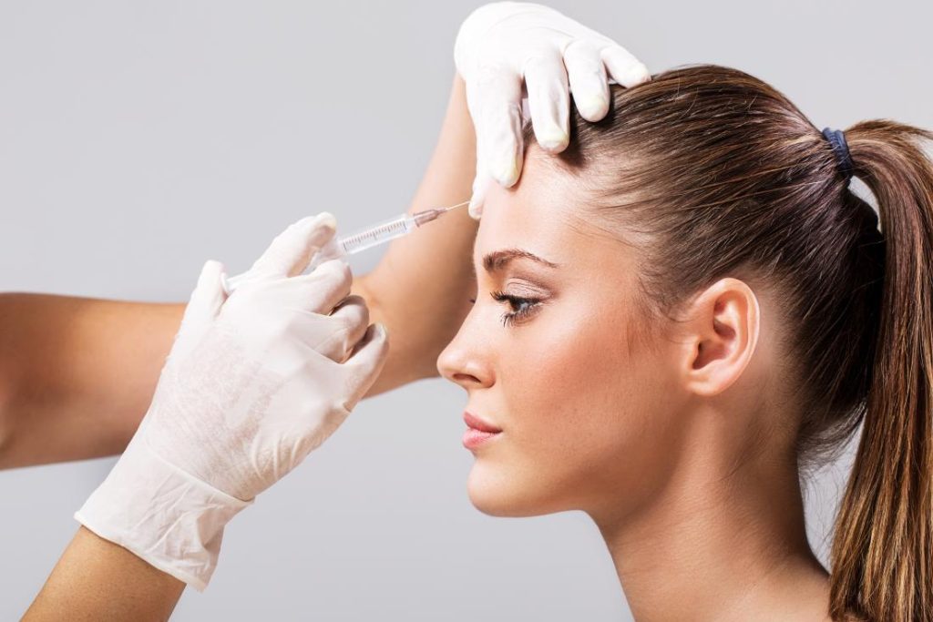 woman having botox injection on forehead